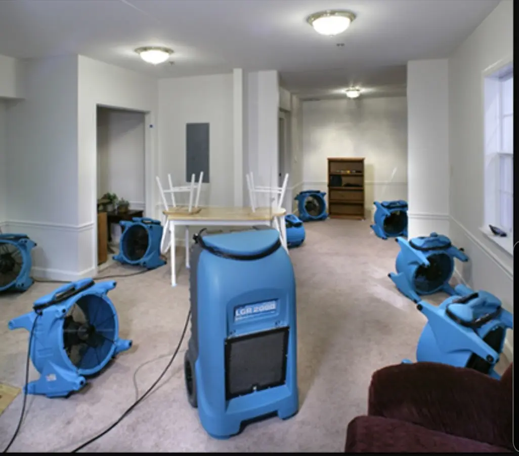 Air movers and dehumidifier setup for Water Damage Restoration in La Porte