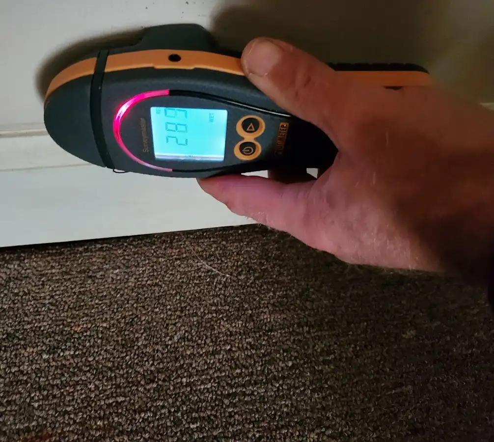 Moisture detection at baseboard during Storm Damage Restoration in La Porte
